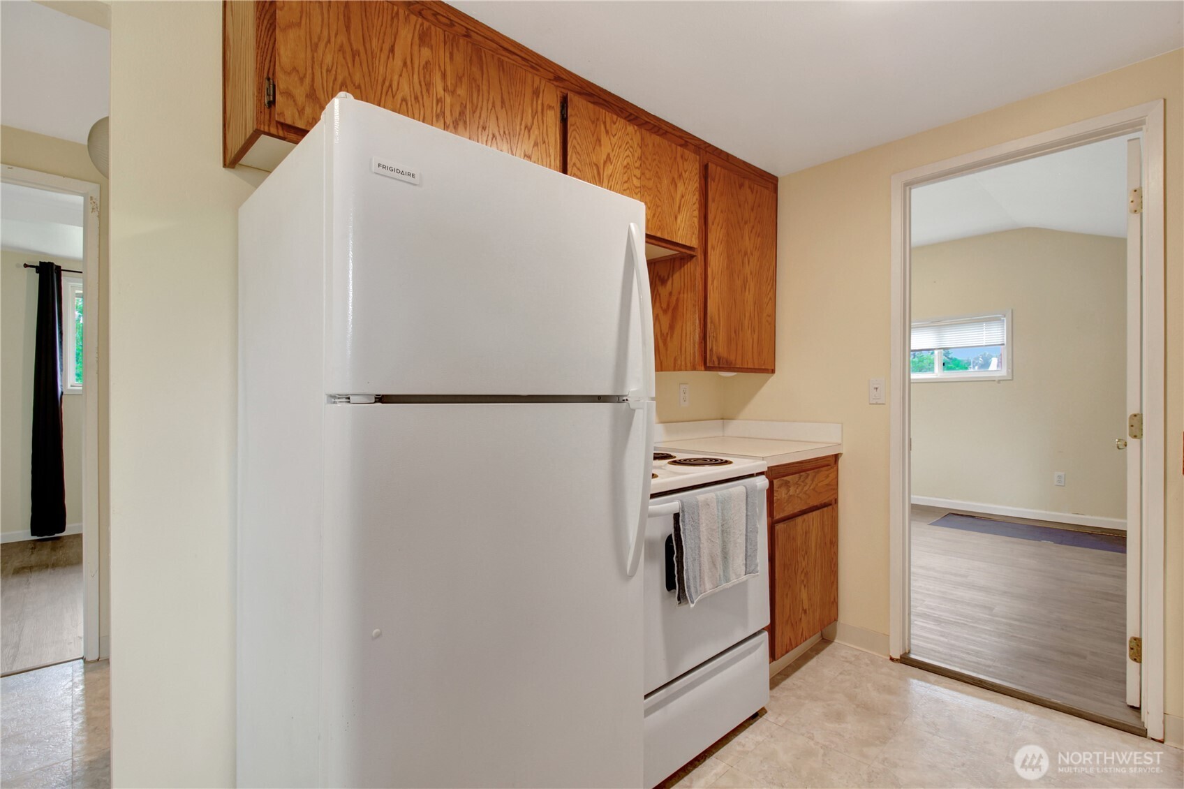 40018 May Creek Road Gold Bar, WA 98251 - Photo 8 of 25 a white refrigerator freezer and a stove sitting inside of a kitchen