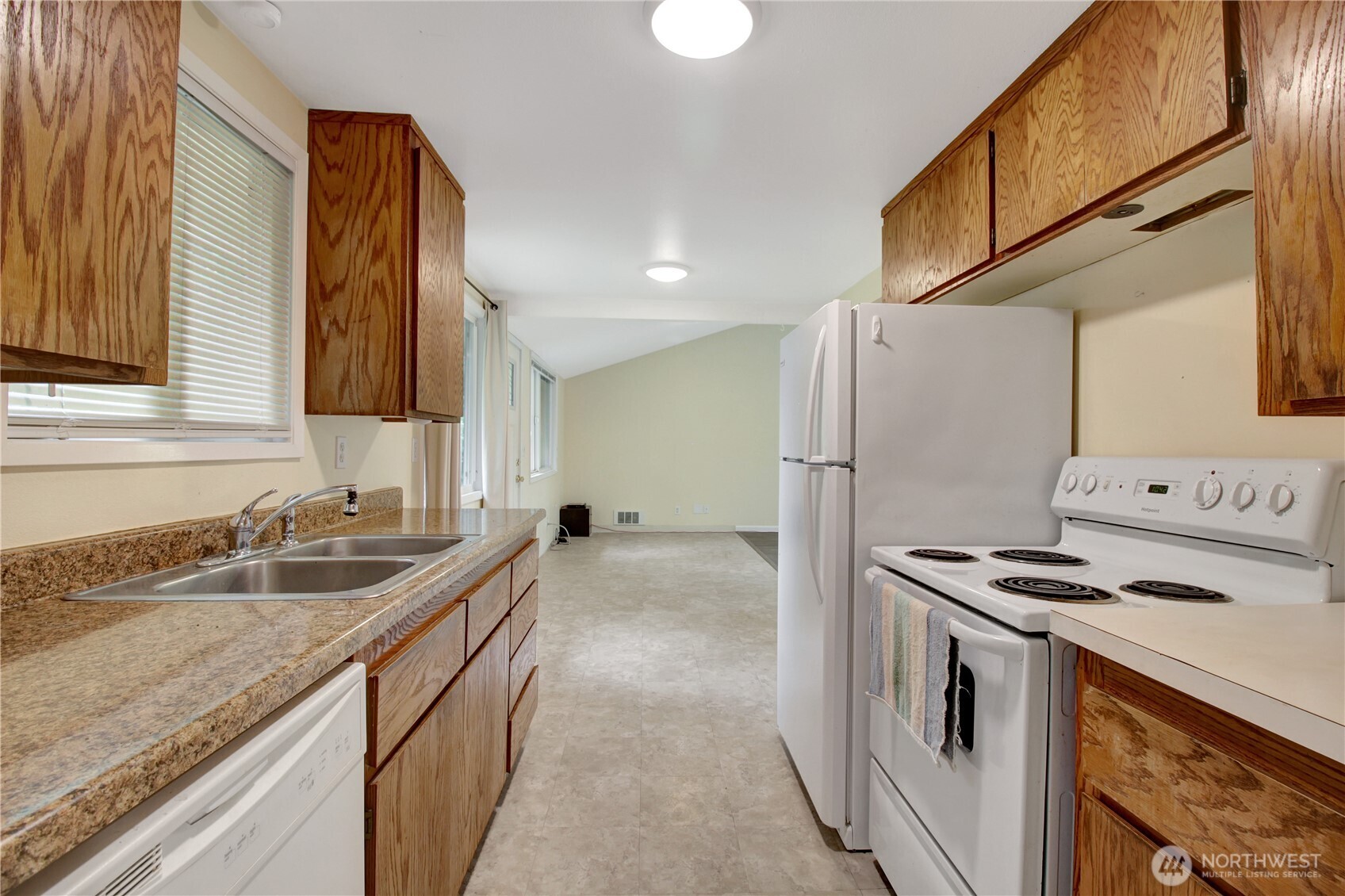 40018 May Creek Road Gold Bar, WA 98251 - Photo 9 of 25 a kitchen that has a sink a stove and a refrigerator