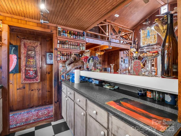 a kitchen with lots of counter top space and stainless steel appliances