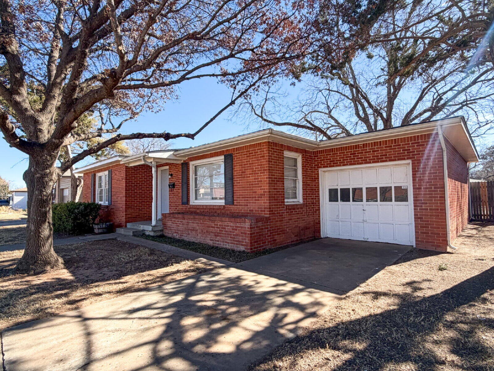 3415 35th Street Lubbock, TX 79413 - Photo 3 of 11 a front view of a house with a yard