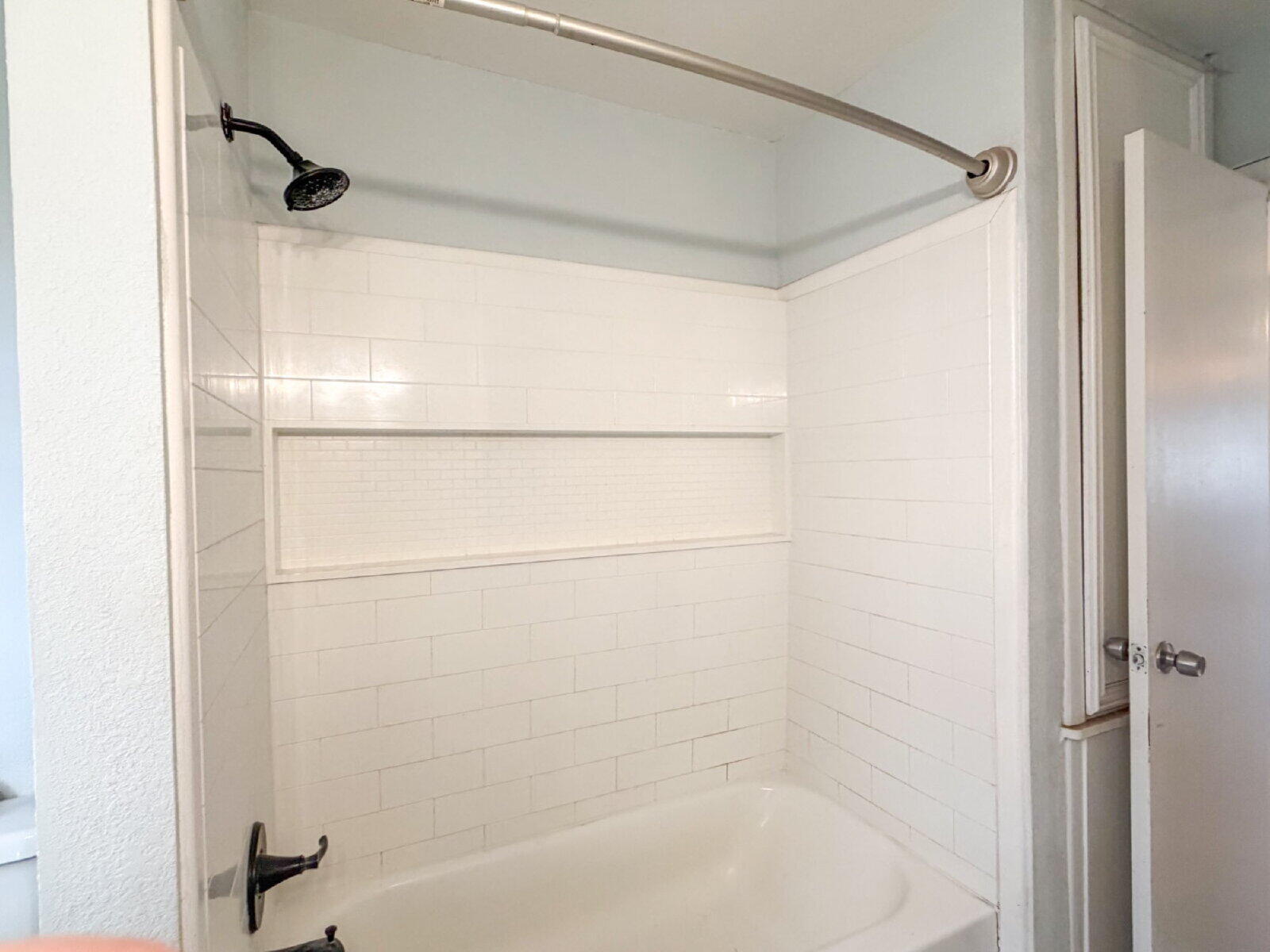 3415 35th Street Lubbock, TX 79413 - Photo 10 of 11 a bathroom with a bathtub