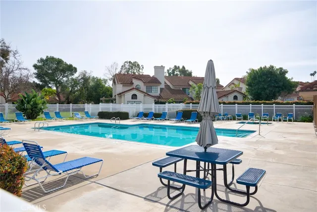 a view of a swimming pool with a lounge chair