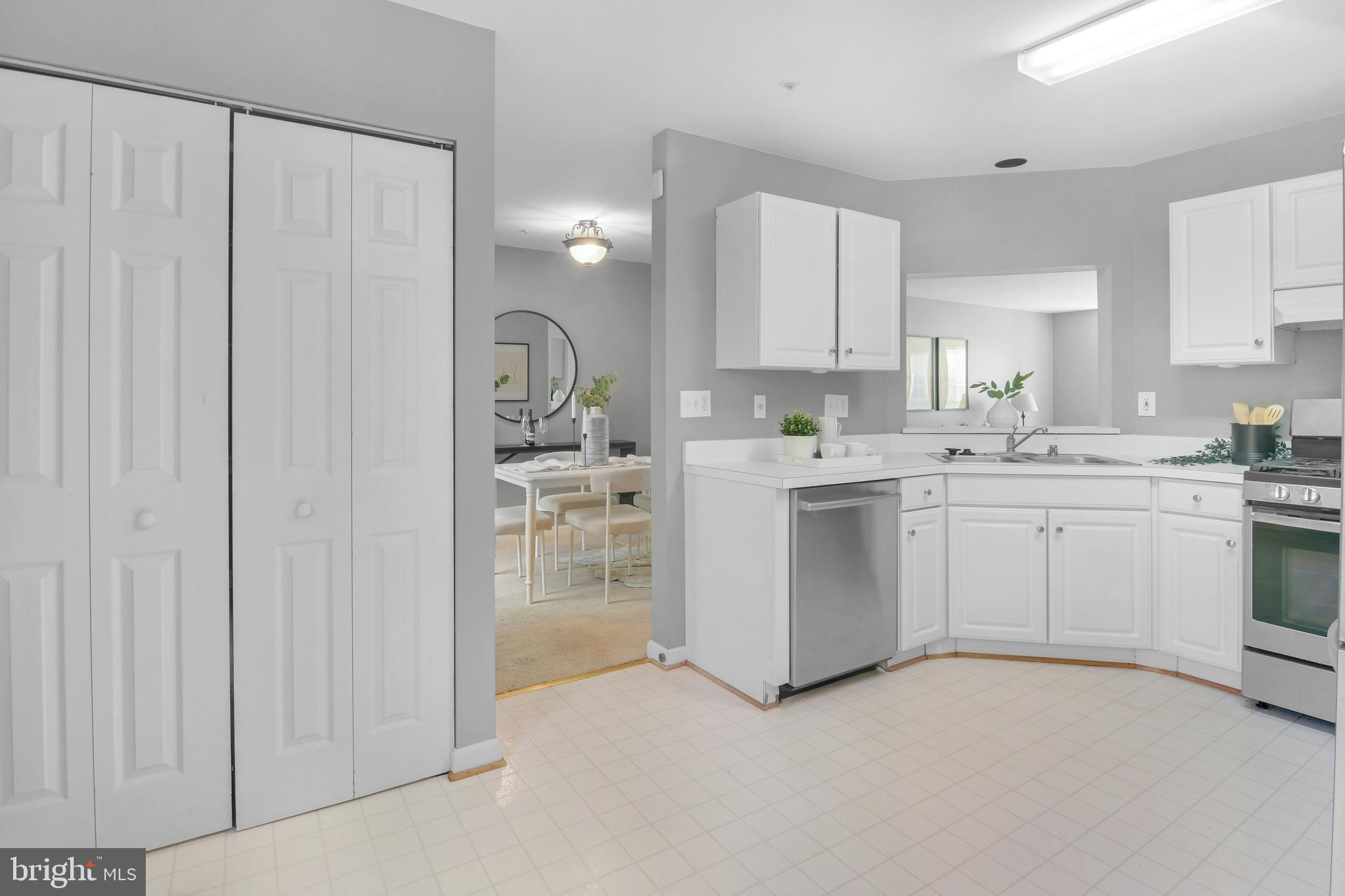 2020 Puritan Terrace Annapolis, MD 21401 - Photo 11 of 33 a kitchen with white cabinets and white appliances