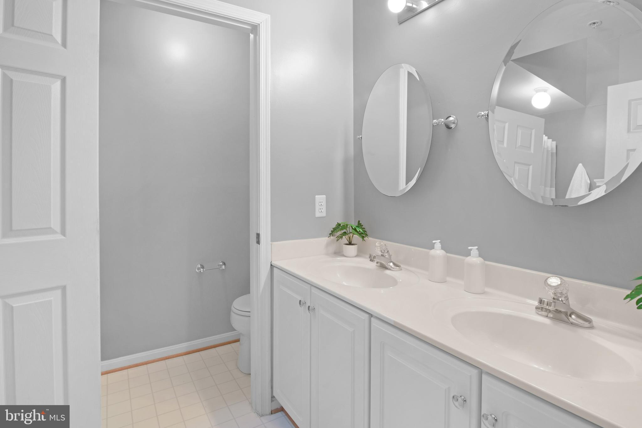 2020 Puritan Terrace Annapolis, MD 21401 - Photo 14 of 33 a bathroom with a sink vanity and a mirror