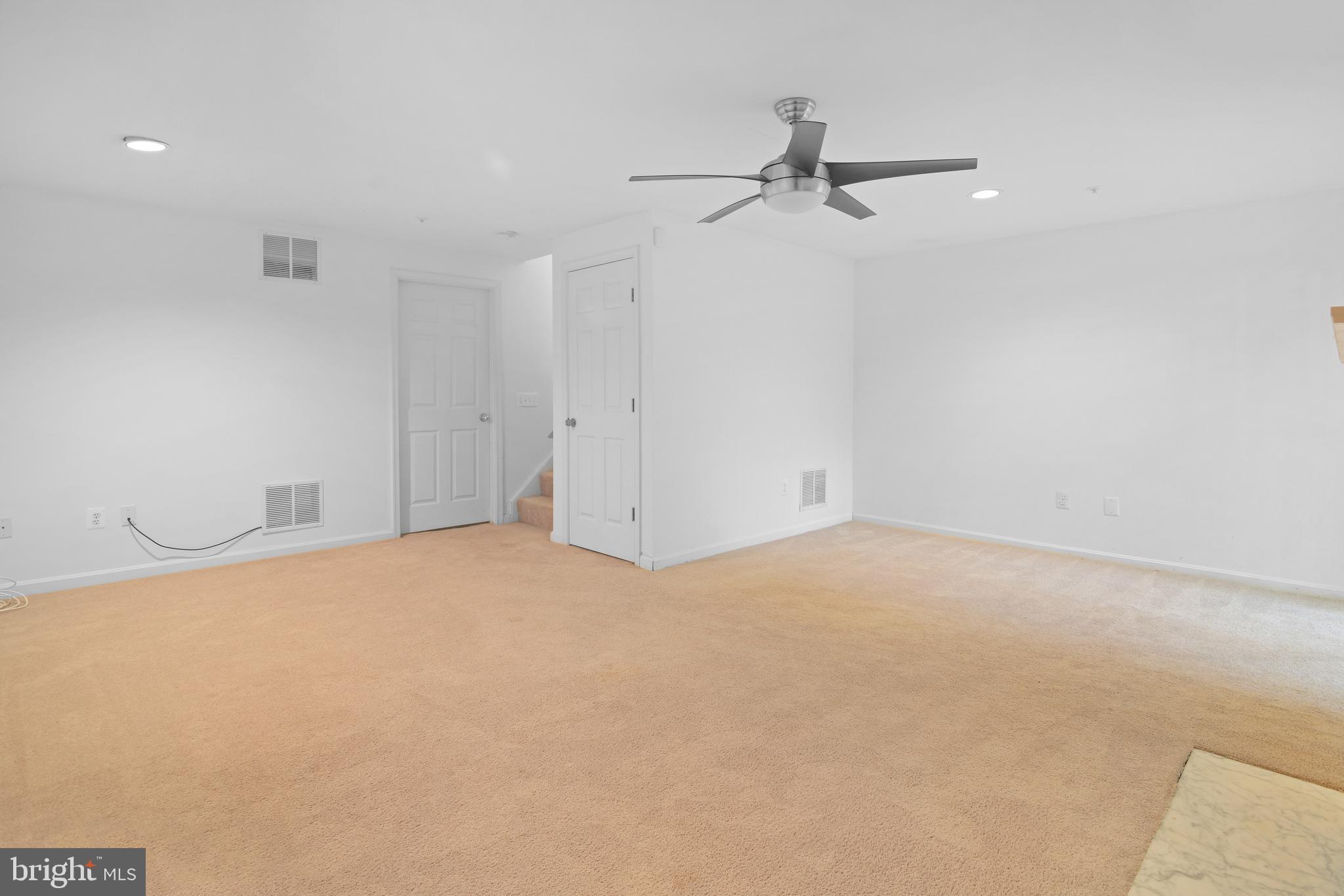 2020 Puritan Terrace Annapolis, MD 21401 - Photo 29 of 33 an empty room with a ceiling fan and wooden floor