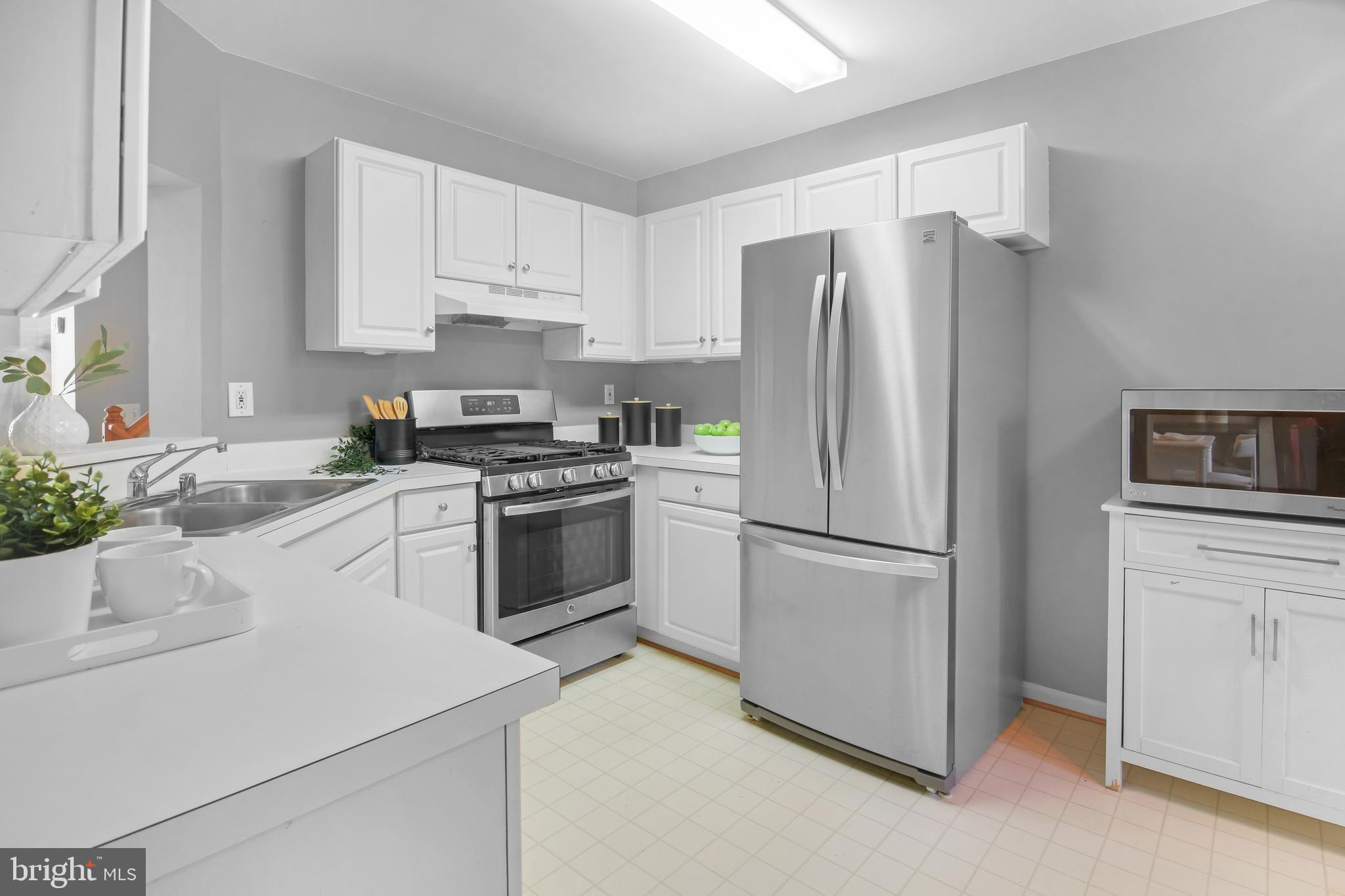 2020 Puritan Terrace Annapolis, MD 21401 - Photo 9 of 33 a kitchen with cabinets stainless steel appliances and a window