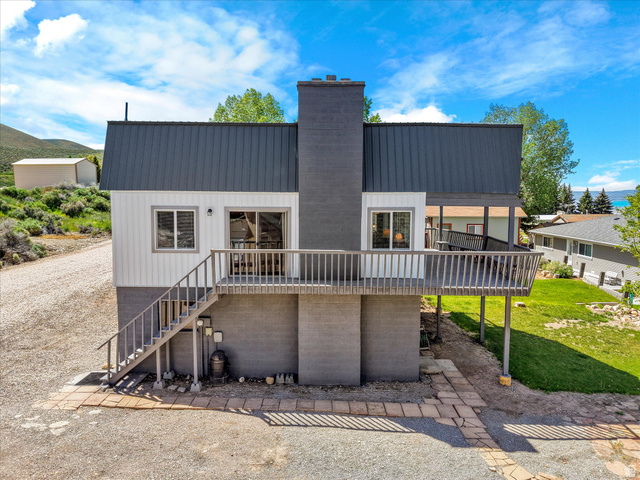 85 B Street, Unit 22 St. Charles, ID 83272 - Photo 9 of 35 Contemporary exterior featuring a charcoal metal roof and matching chimney