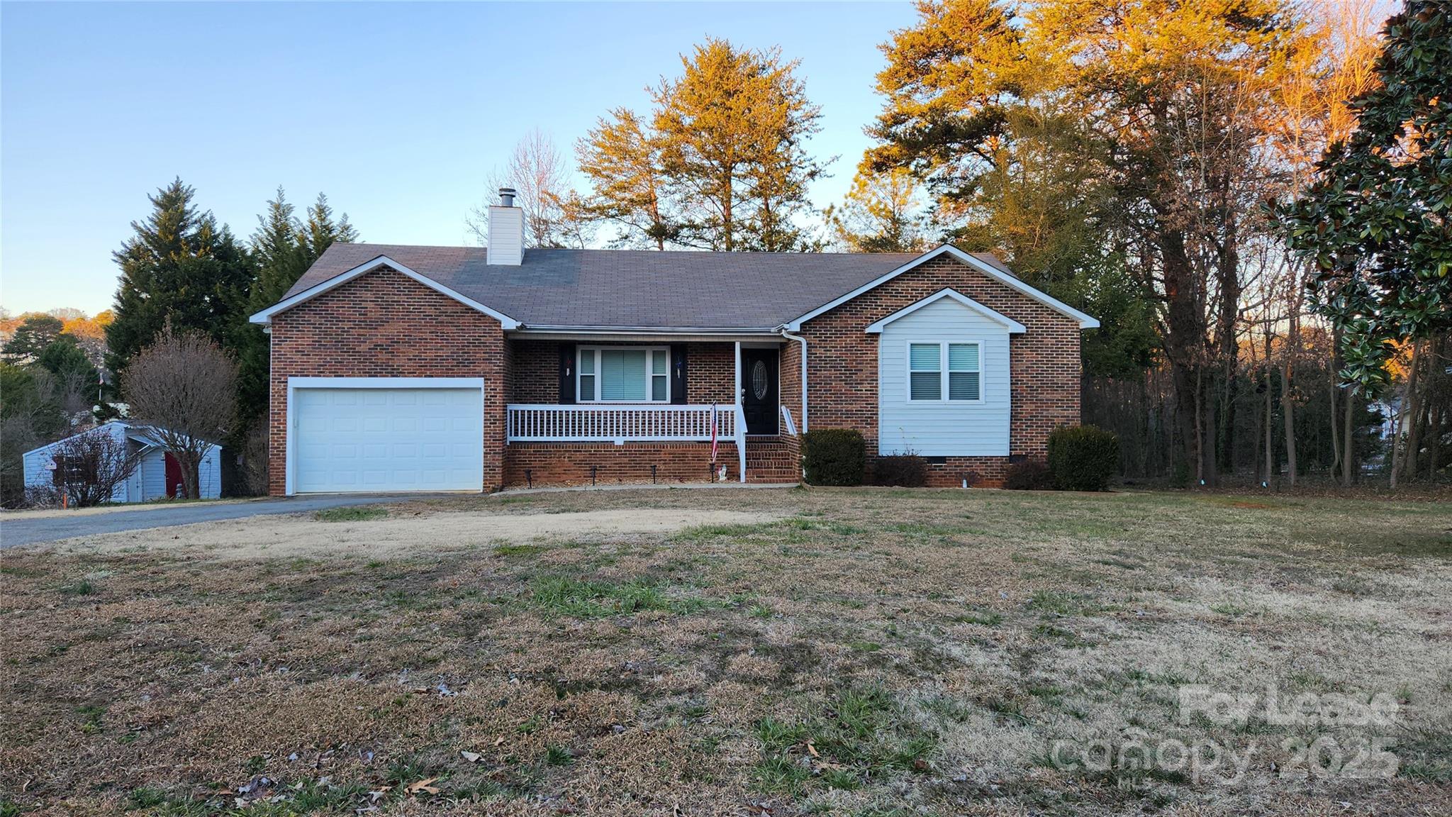 7505 Sarah Drive Denver, NC 28037 - Photo 1 of 13 a front view of a house with a yard and garage