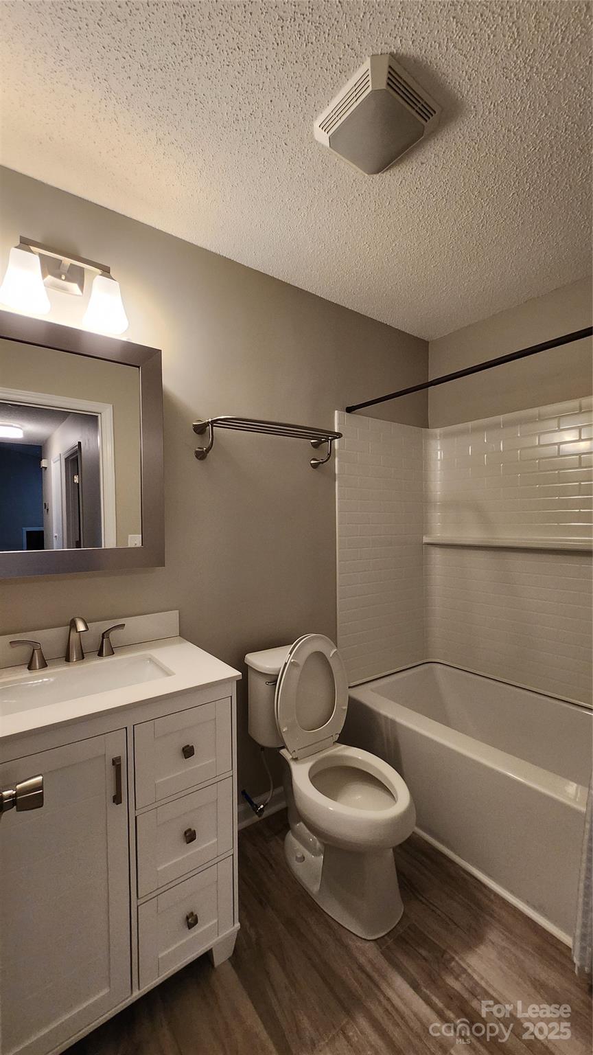 7505 Sarah Drive Denver, NC 28037 - Photo 13 of 13 a bathroom with a toilet a sink and a mirror