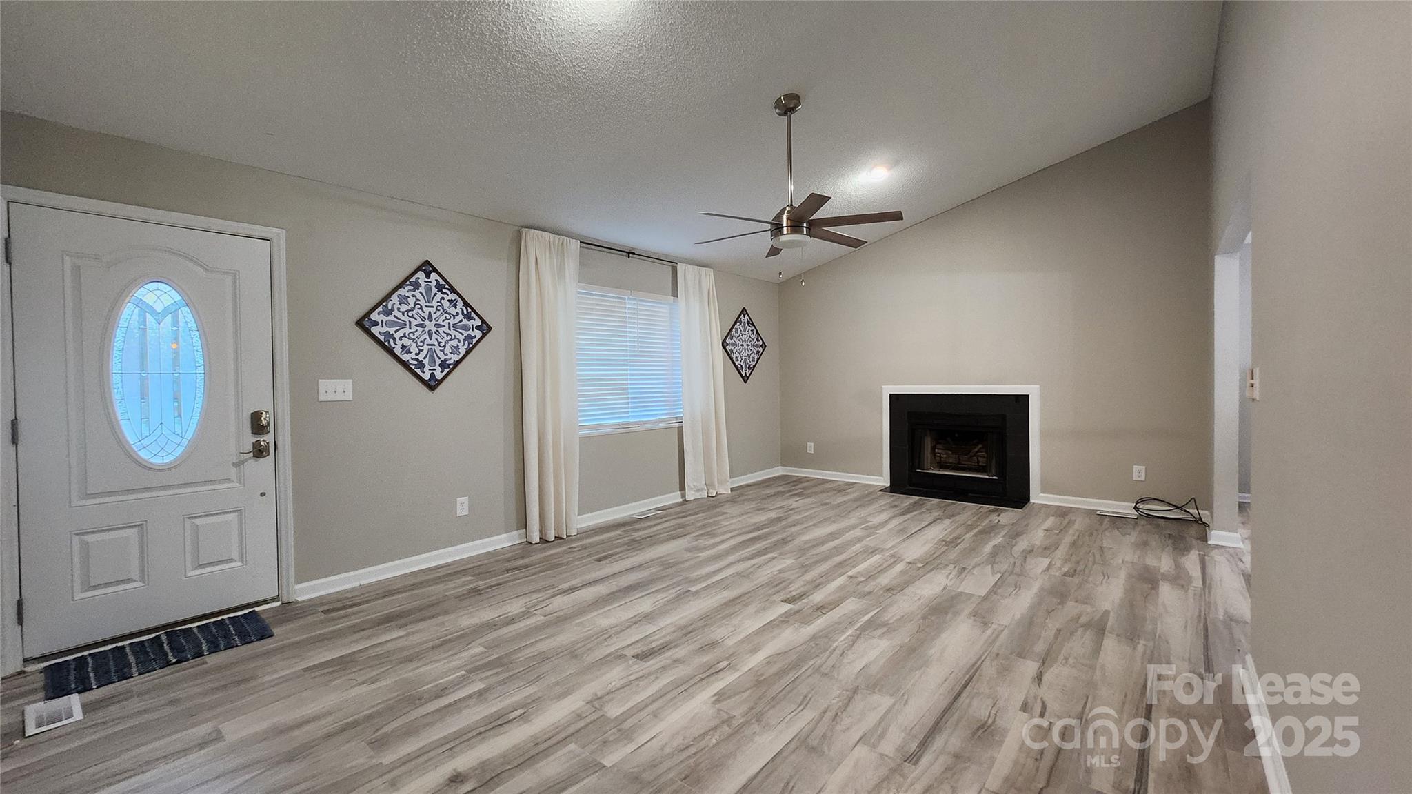 7505 Sarah Drive Denver, NC 28037 - Photo 4 of 13 a view of empty room with wooden floor