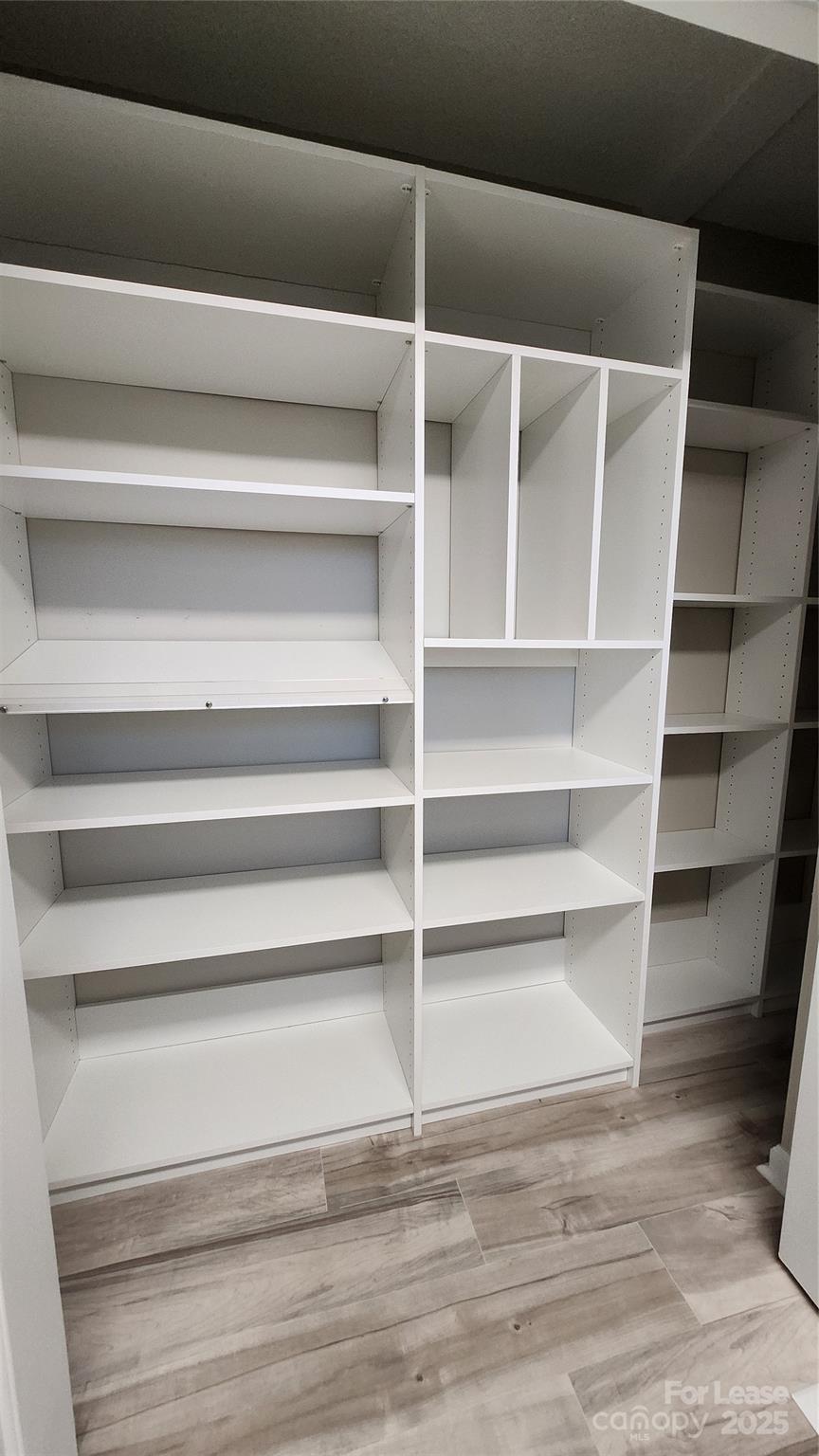 7505 Sarah Drive Denver, NC 28037 - Photo 6 of 13 a view of walk in closet with empty racks