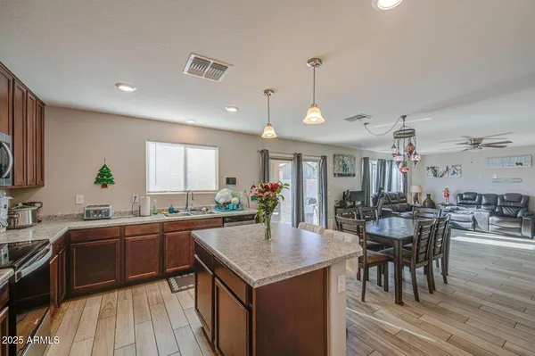 a kitchen with lots of counter top space and dining table