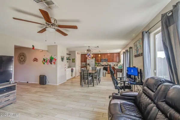 a view of a livingroom with furniture and a window