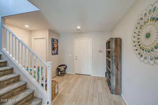 a view of entryway with wooden floor
