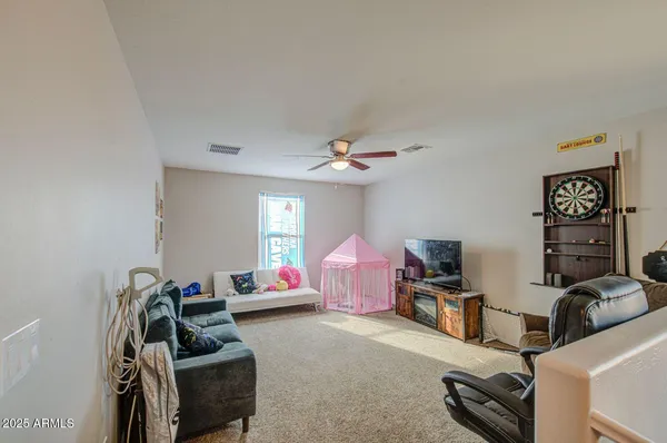 a bedroom with furniture and a gym equipment