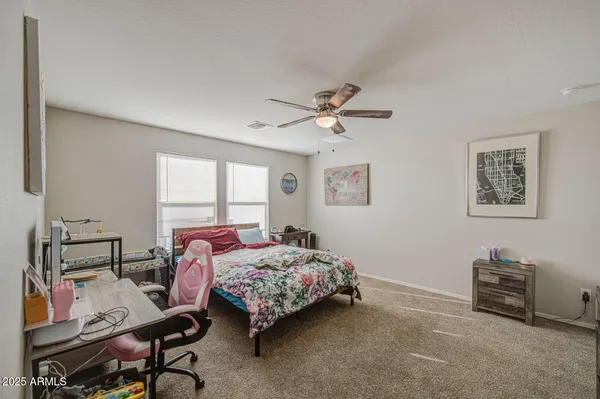a bedroom with furniture and a window