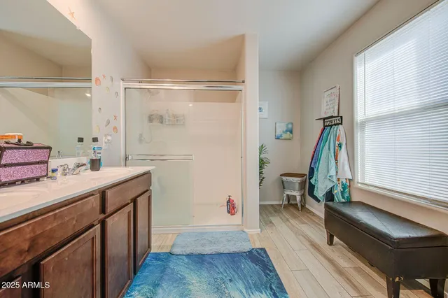 a bathroom with a sink a toilet and a shower