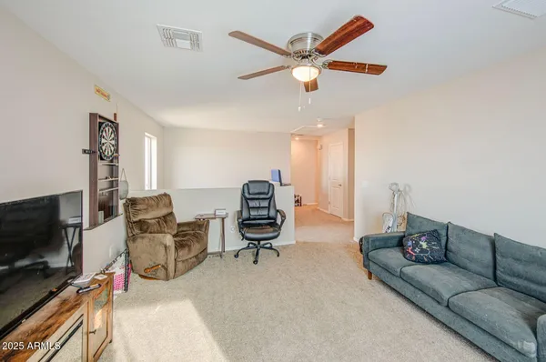 a spacious bathroom with a sink and a mirror
