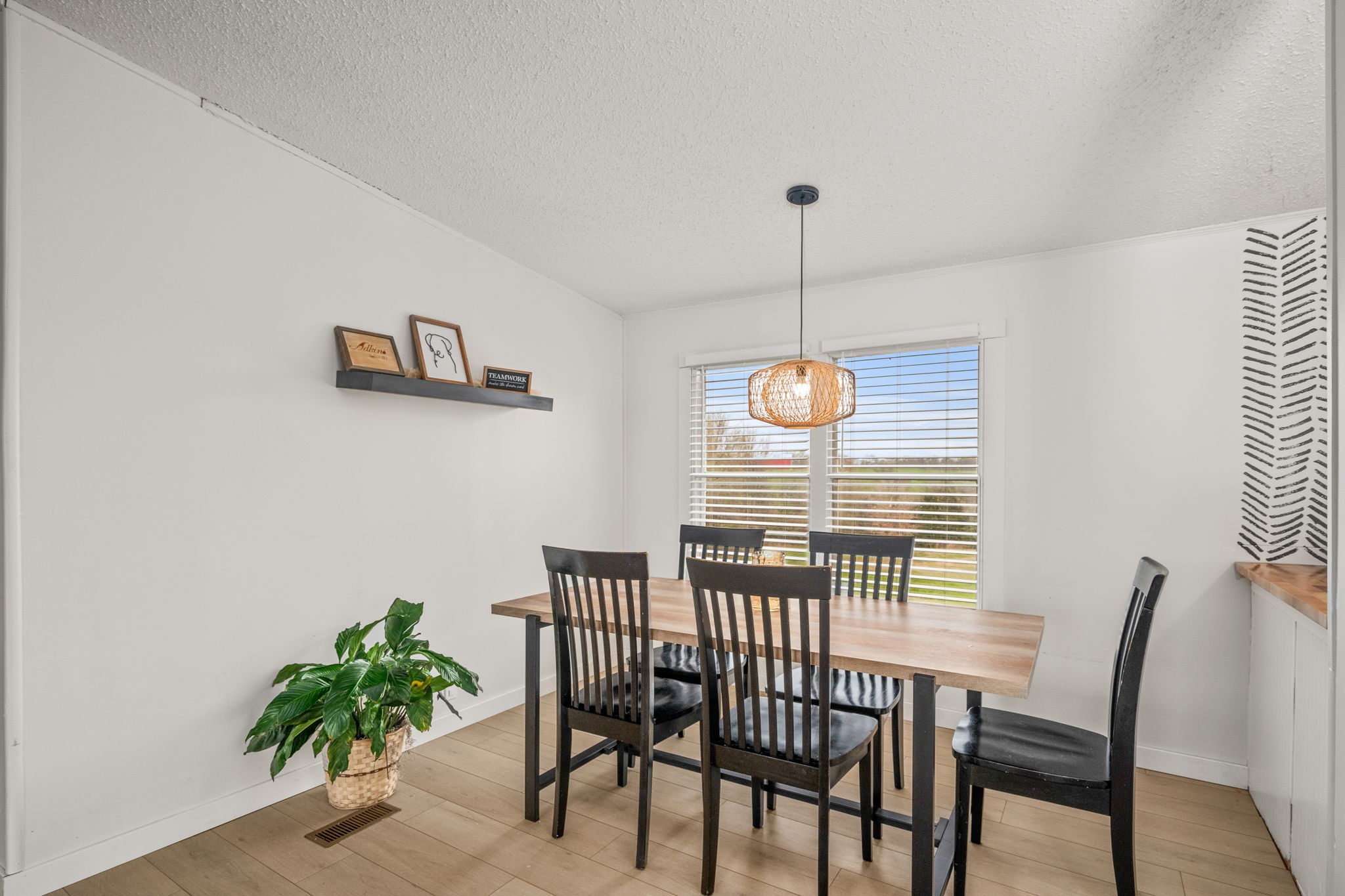 1848 Mint Springs Road Adams, TN 37010 - Photo 11 of 36 a view of a dining room with furniture window and wooden floor