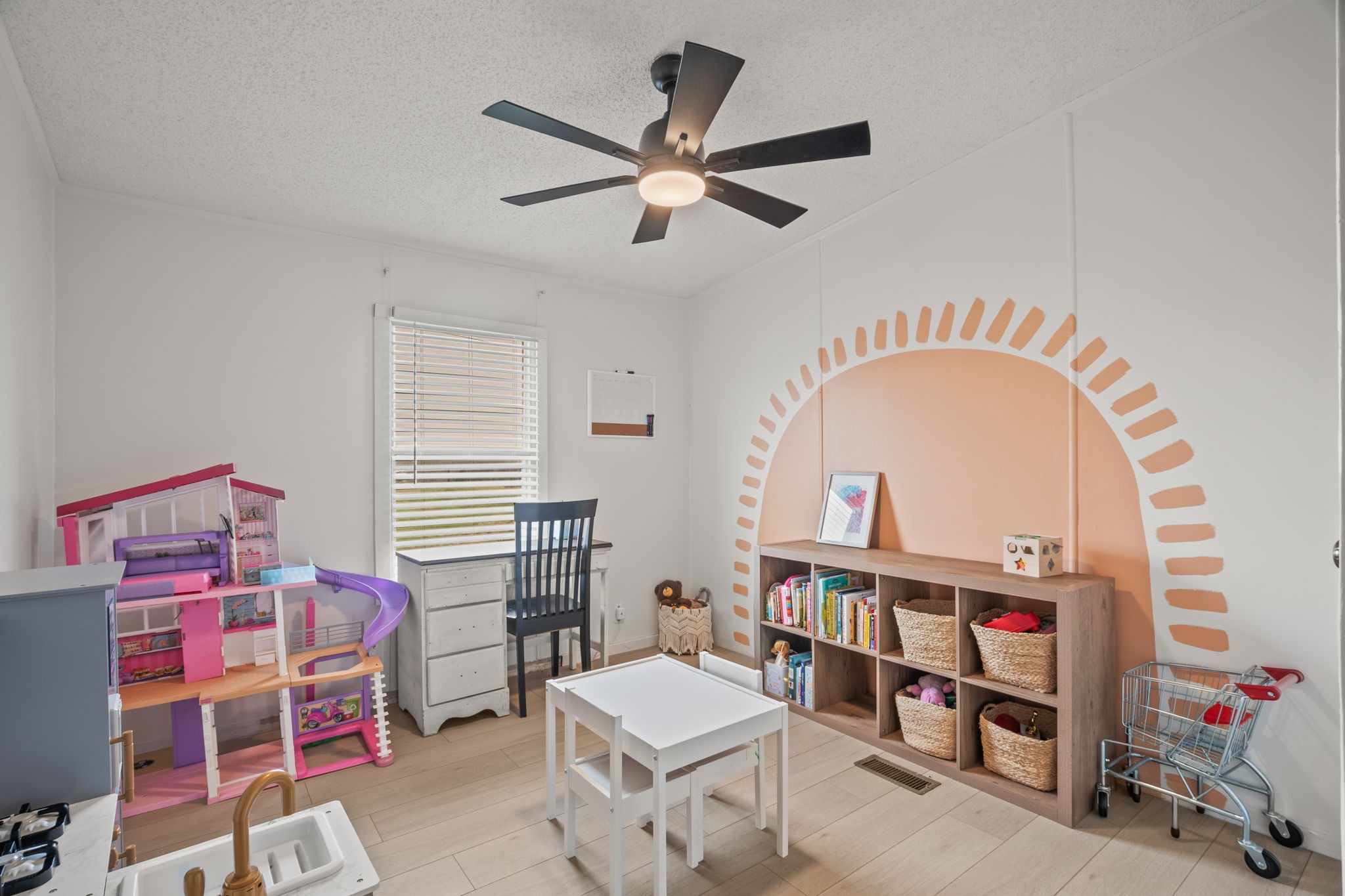 1848 Mint Springs Road Adams, TN 37010 - Photo 18 of 36 a living room with a baby crib furniture and a wooden floor