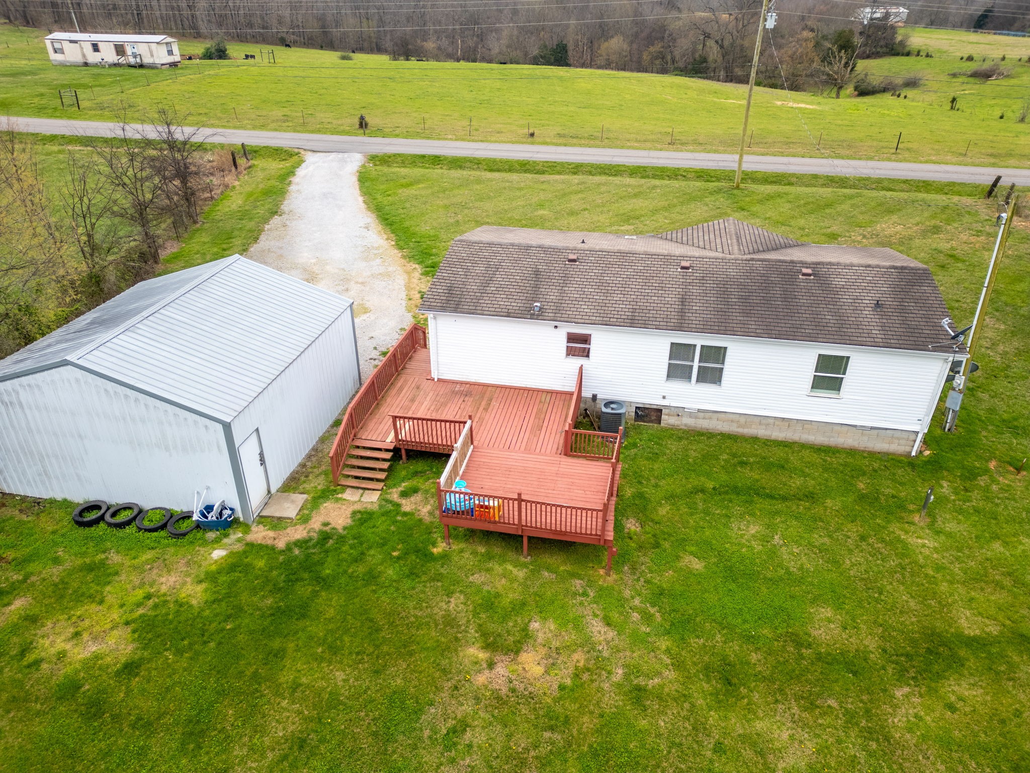 1848 Mint Springs Road Adams, TN 37010 - Photo 26 of 36 a aerial view of a house with a yard basket ball court and outdoor seating