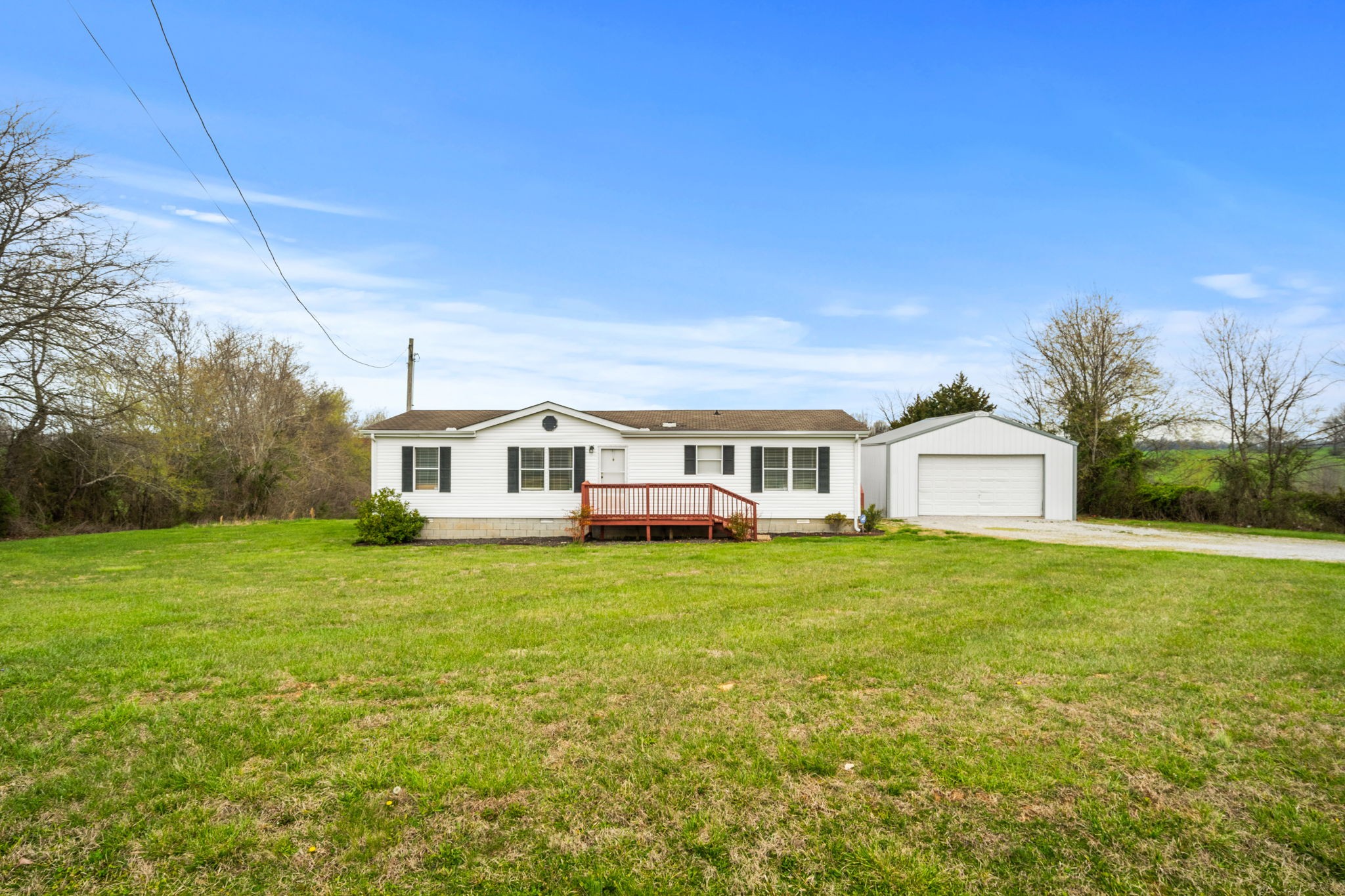 1848 Mint Springs Road Adams, TN 37010 - Photo 3 of 36 a front view of a house with a garden