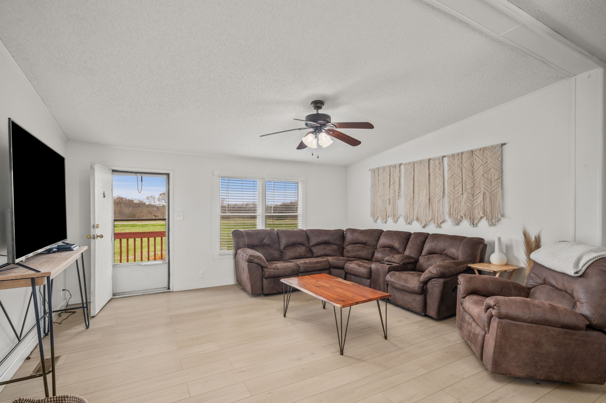 1848 Mint Springs Road Adams, TN 37010 - Photo 8 of 36 a living room with furniture and a flat screen tv