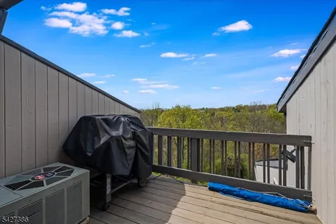 a view of balcony with furniture