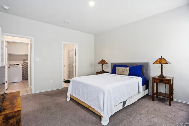 a bedroom with a bed and a mirror