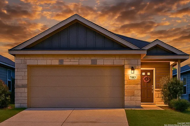 a view of wooden house with a small yard