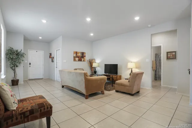 a living room with furniture and a table