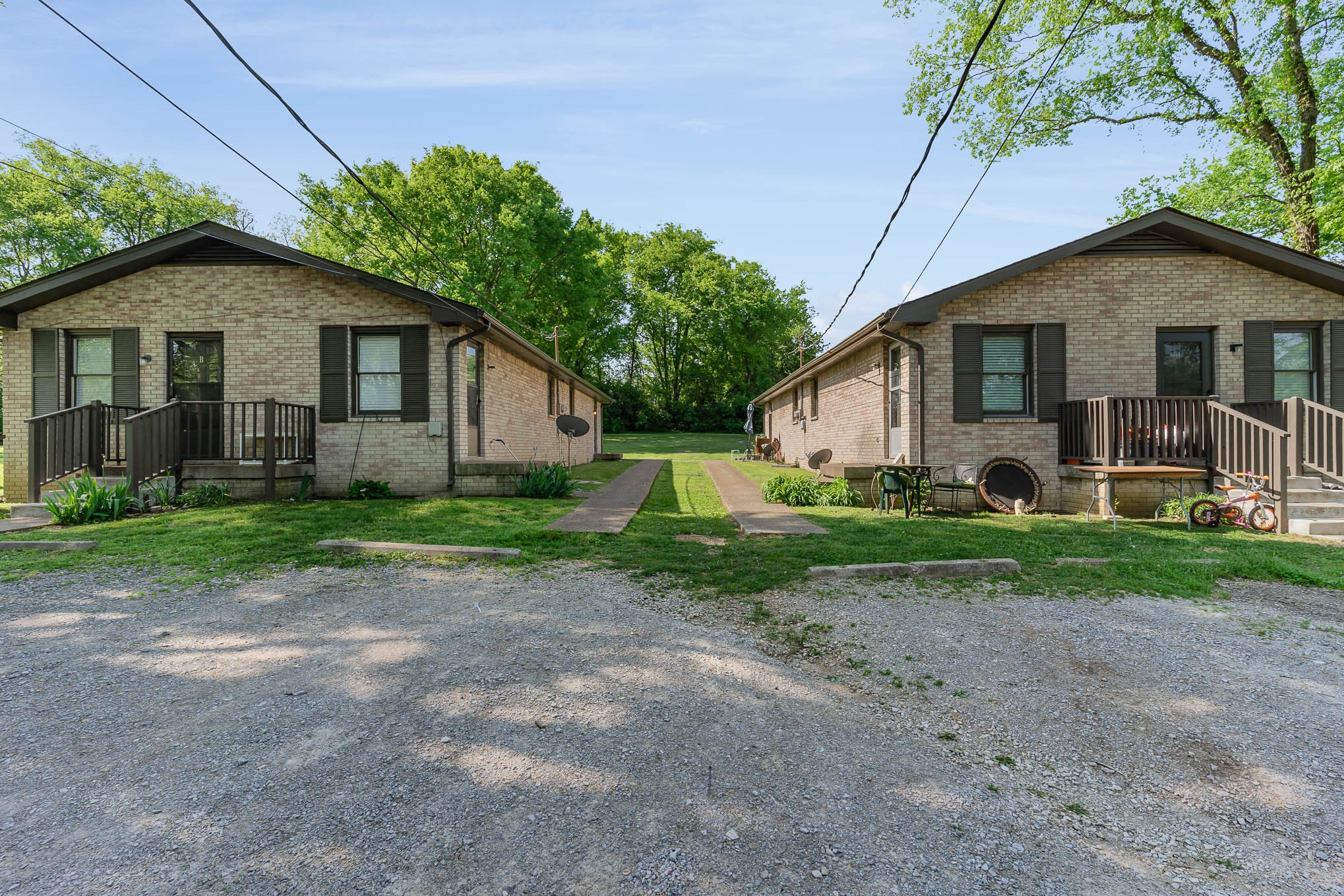 a view of a house with yard and a garden