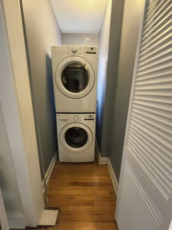 a view of a storage and utility room with washer and dryer
