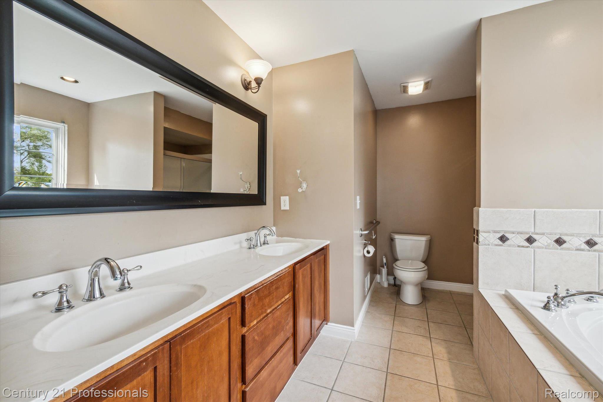1150 Ridge Road South Canton, MI 48188 - Photo 27 of 51 Double Sinks in Primary Bath With Jetted Tub