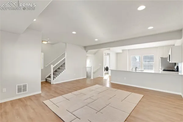 a very nice looking living room with a large window