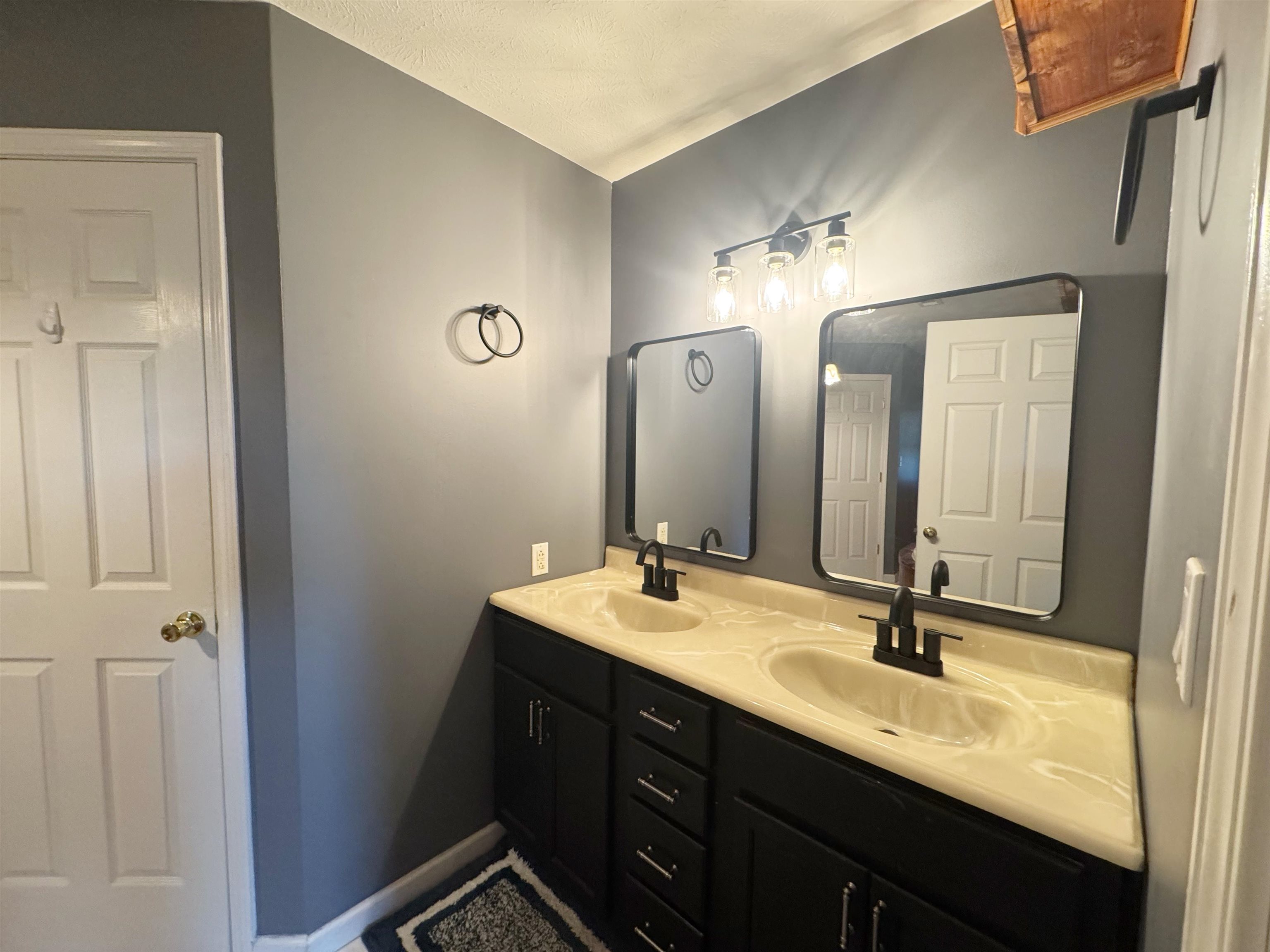112 York Commons Ripley, TN 38063 - Photo 14 of 29 a bathroom with a double vanity sink and a mirror