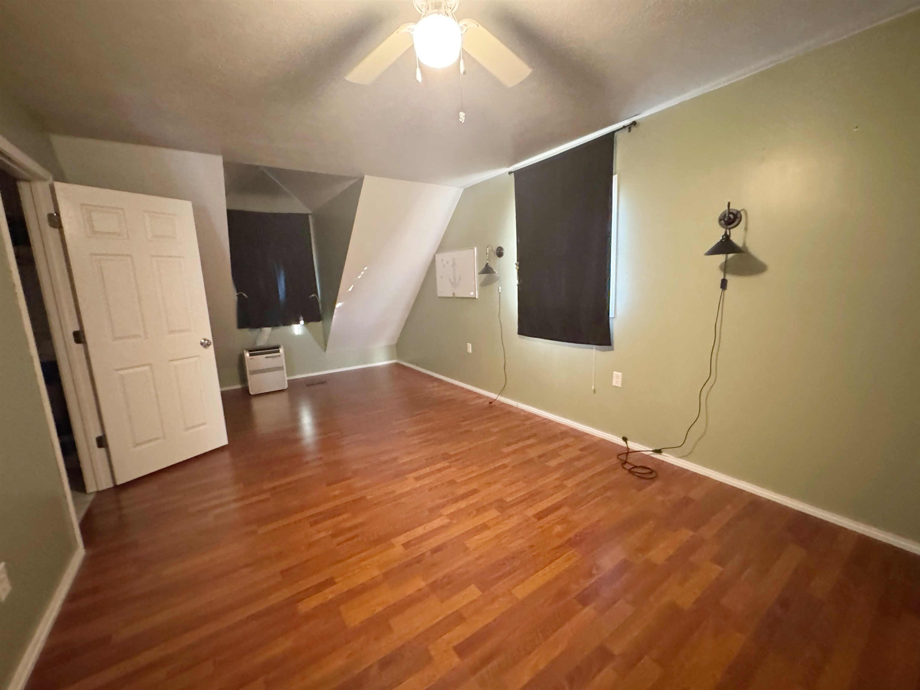 112 York Commons Ripley, TN 38063 - Photo 19 of 29 a view of an empty room with wooden floor and a window