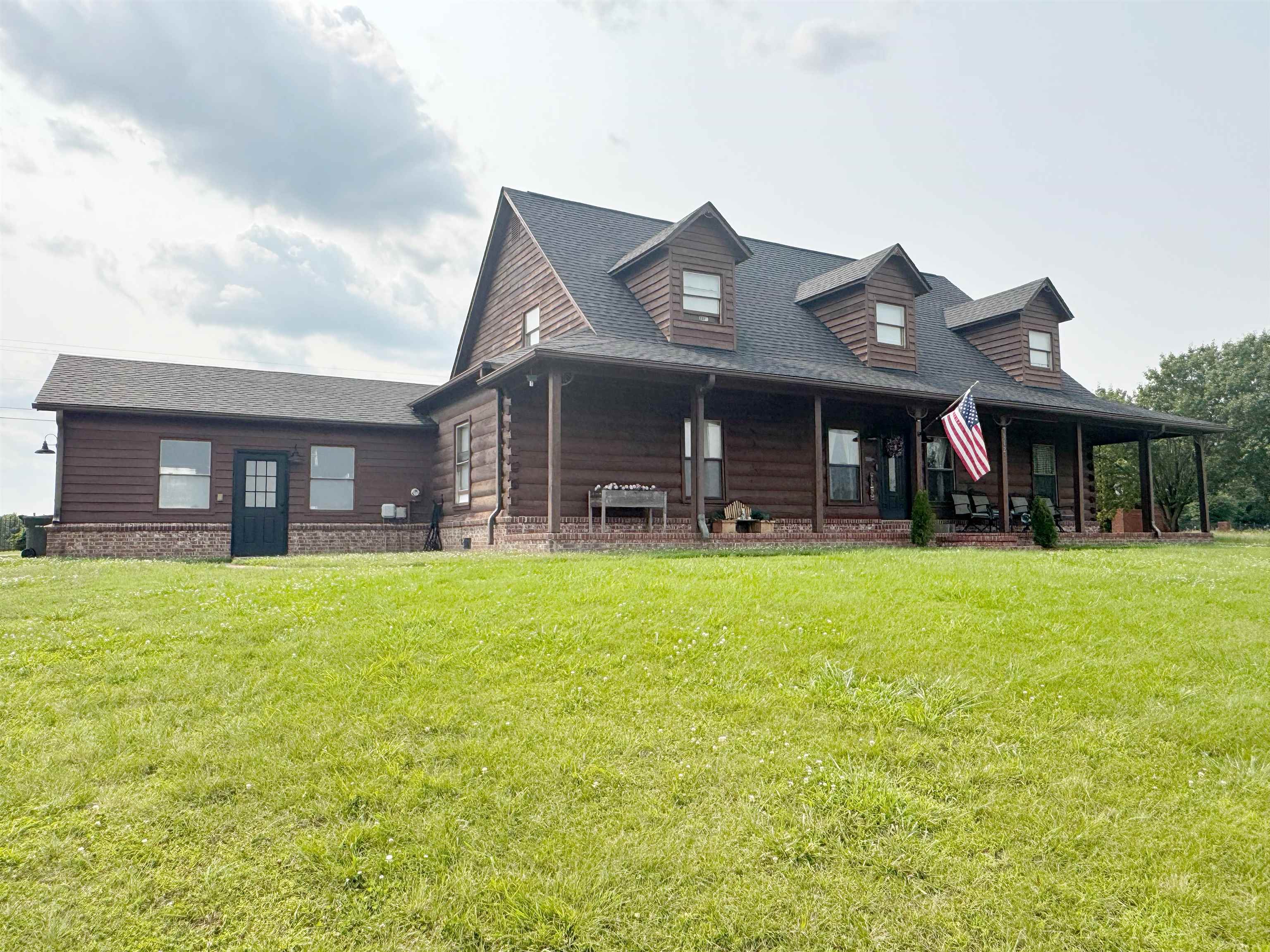 112 York Commons Ripley, TN 38063 - Photo 2 of 29 front view of a brick house with a yard