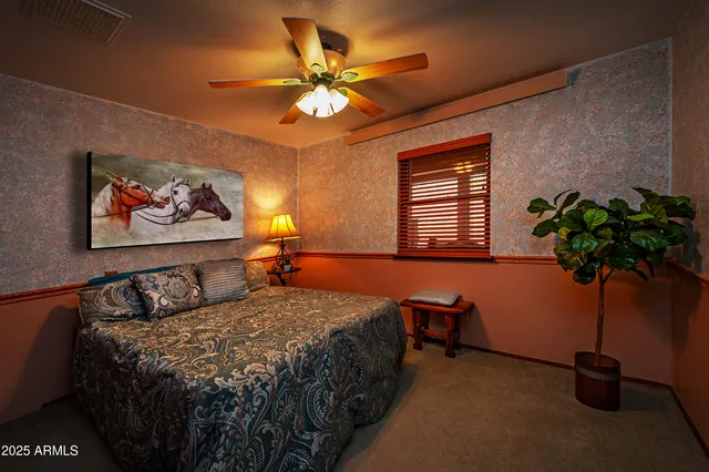 a work room with furniture and potted plants