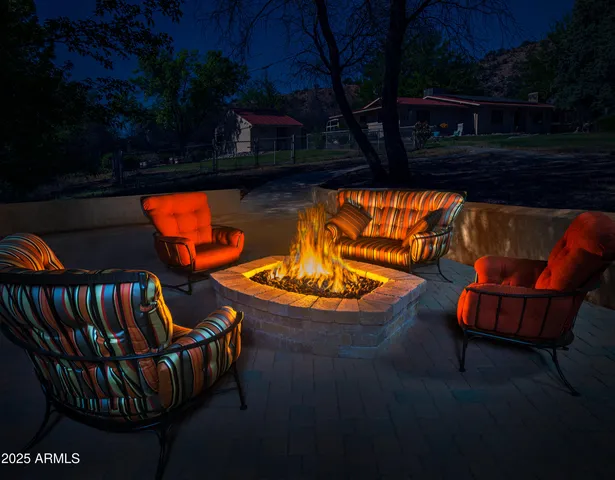 a view of swimming pool with outdoor seating and yard in back