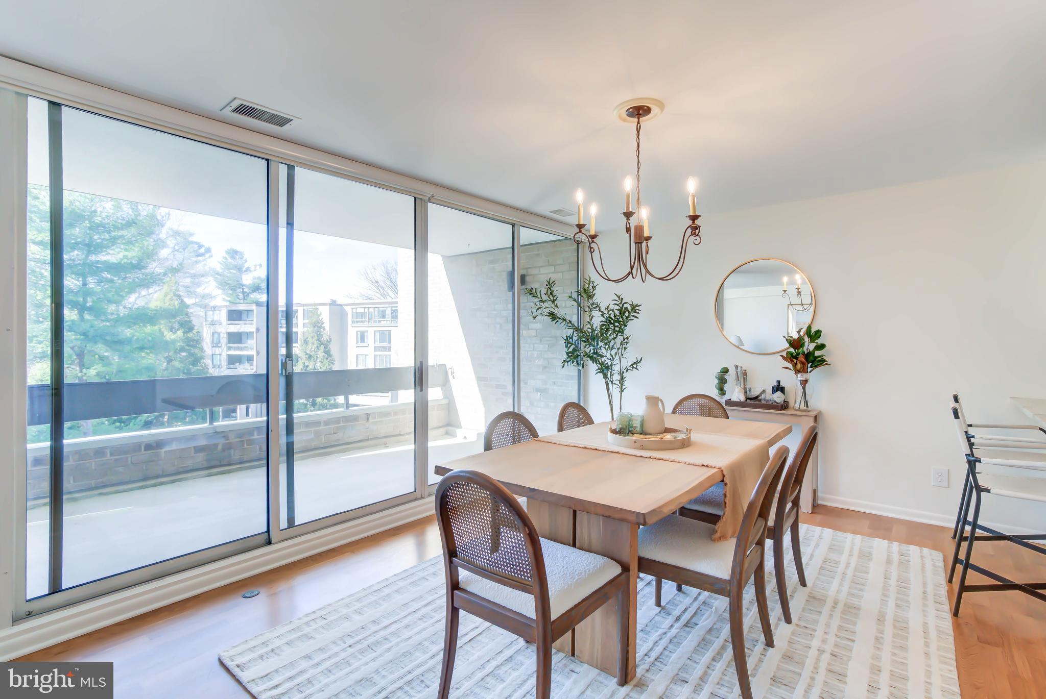 4936 Sentinel Drive, Unit 302 Bethesda, MD 20816 - Photo 13 of 52 Dining Room with Automated Sun Shades