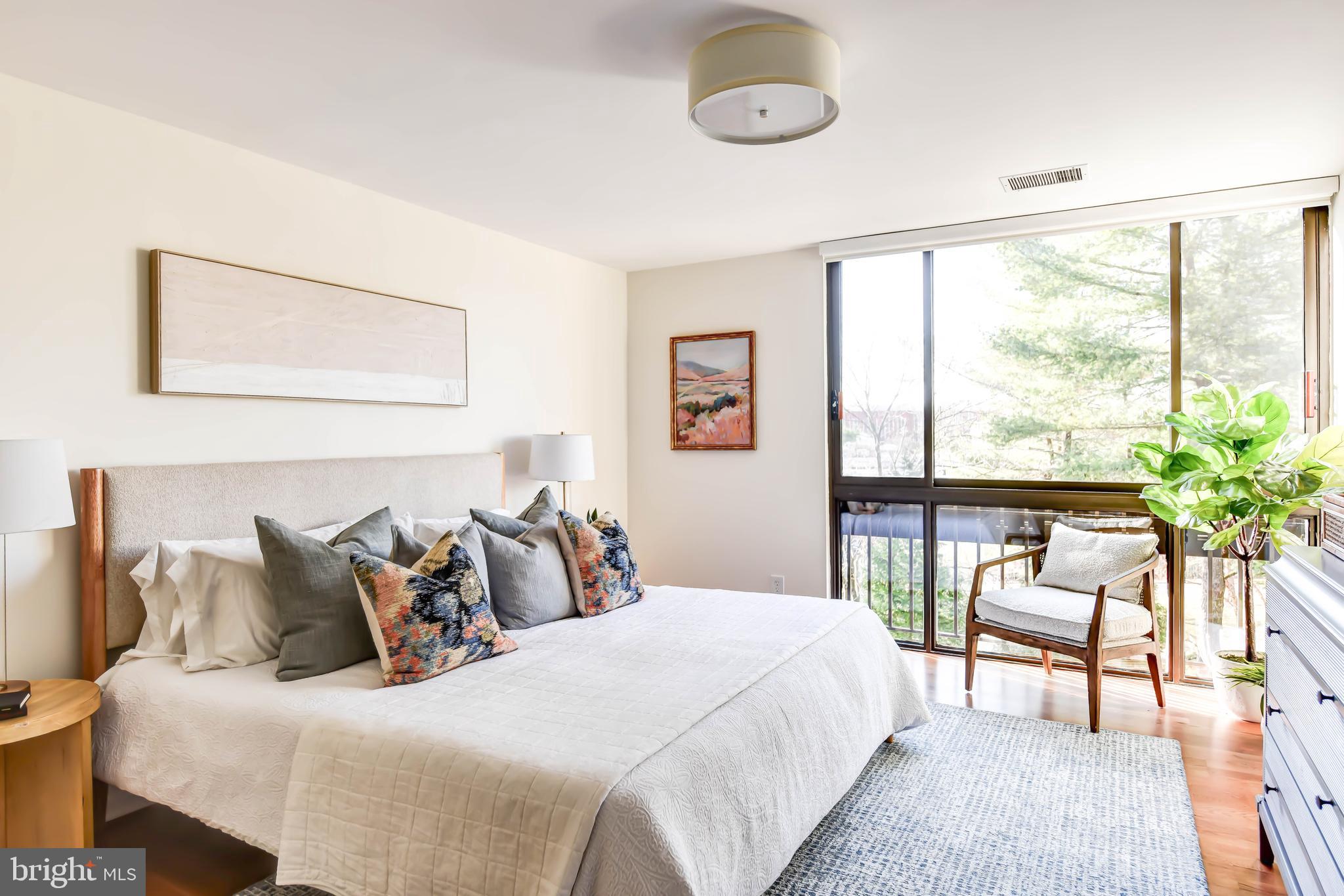 4936 Sentinel Drive, Unit 302 Bethesda, MD 20816 - Photo 23 of 52 Primary Suite w Floor to Ceiling Window