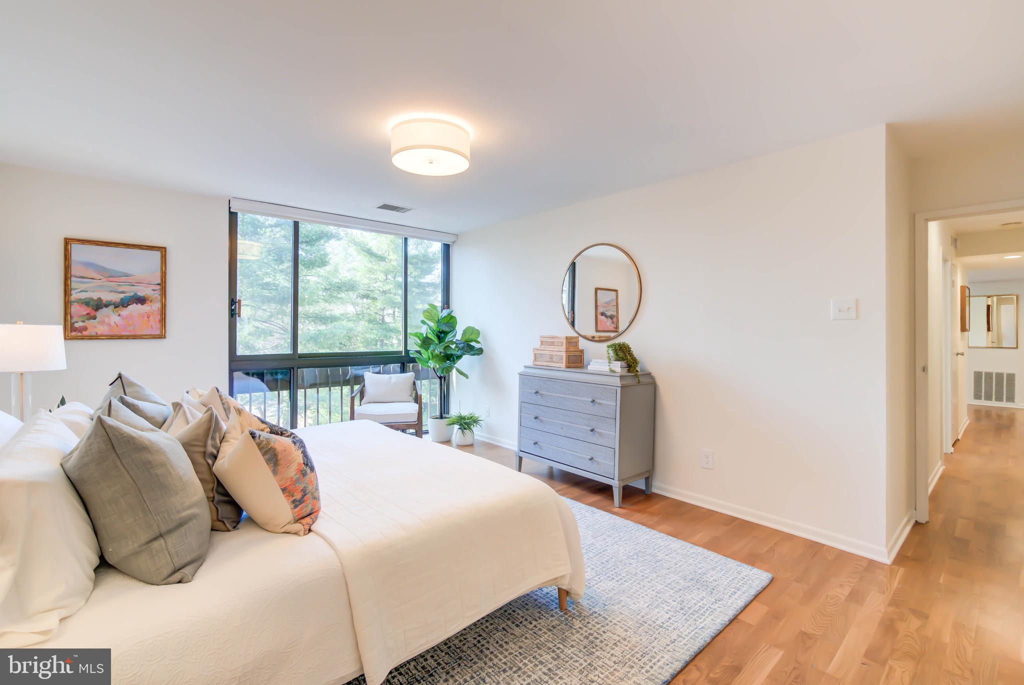 4936 Sentinel Drive, Unit 302 Bethesda, MD 20816 - Photo 25 of 52 Primary Suite w Floor to Ceiling Window