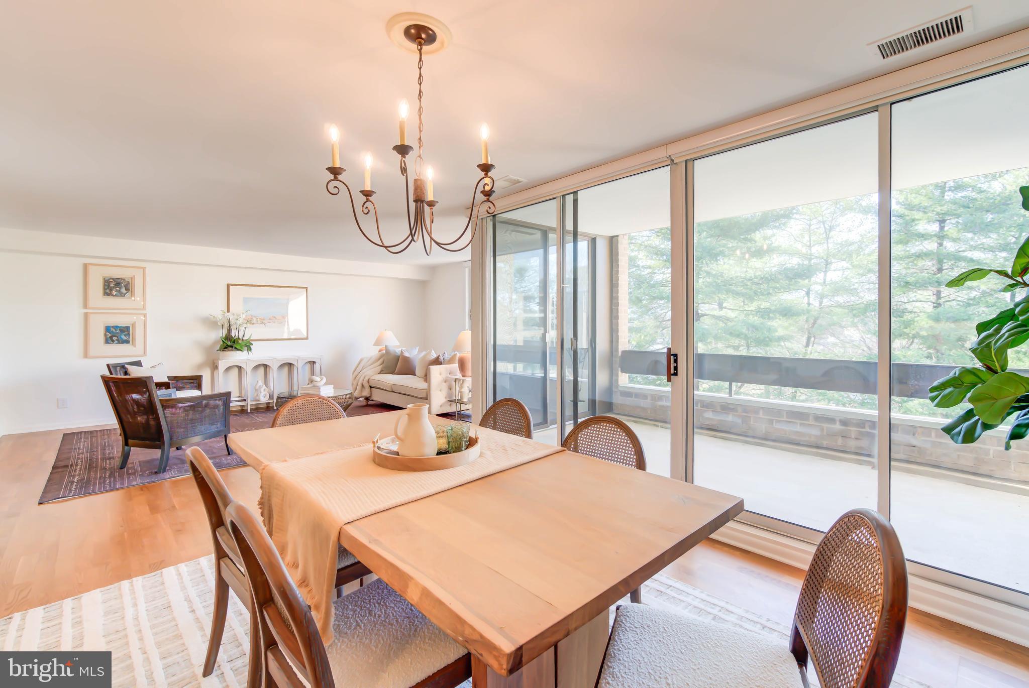 4936 Sentinel Drive, Unit 302 Bethesda, MD 20816 - Photo 7 of 52 Expansive Dining Area- Wall of Sliding Glass Doors