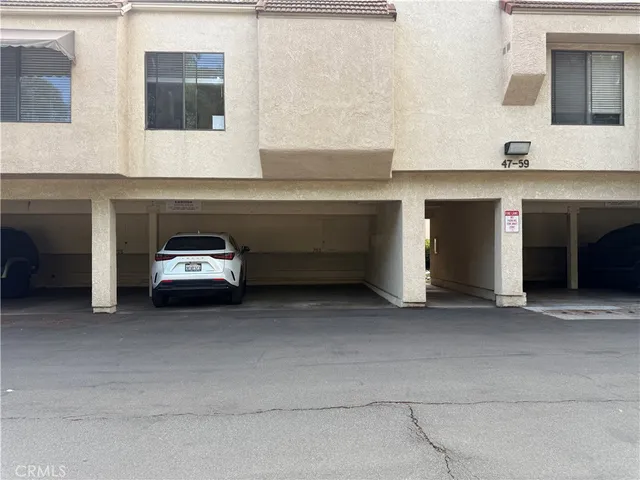 a utility room with a sink and cabinets