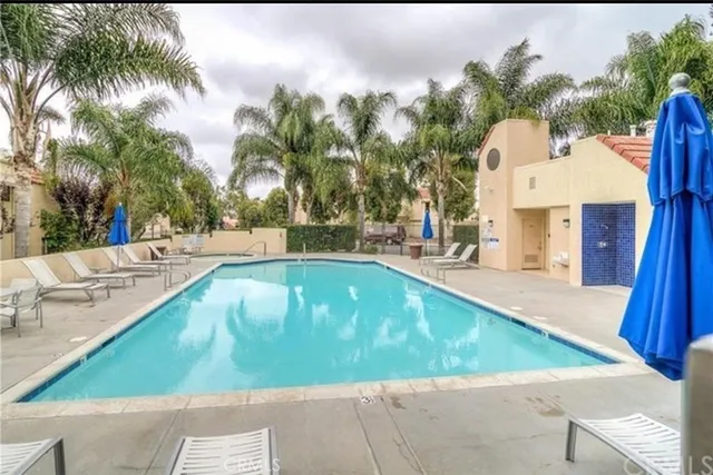 a view of swimming pool with a patio