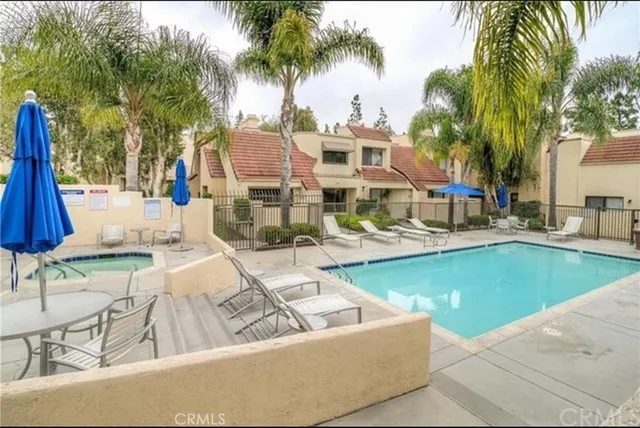 a view of a swimming pool with a lounge chairs