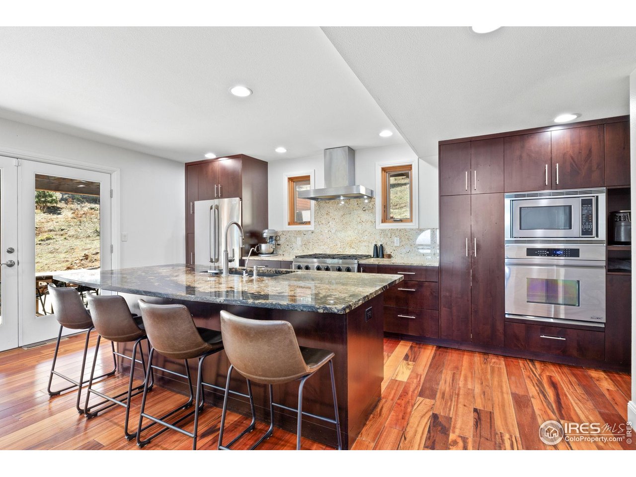 8543 Middle Fork Road Boulder, CO 80302 - Photo 15 of 48 a kitchen with stainless steel appliances granite countertop a sink and a refrigerator