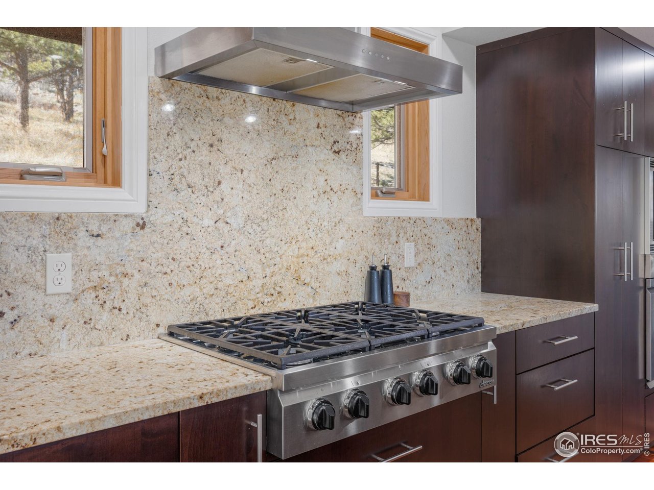 8543 Middle Fork Road Boulder, CO 80302 - Photo 16 of 48 a stove top oven sitting inside of a kitchen