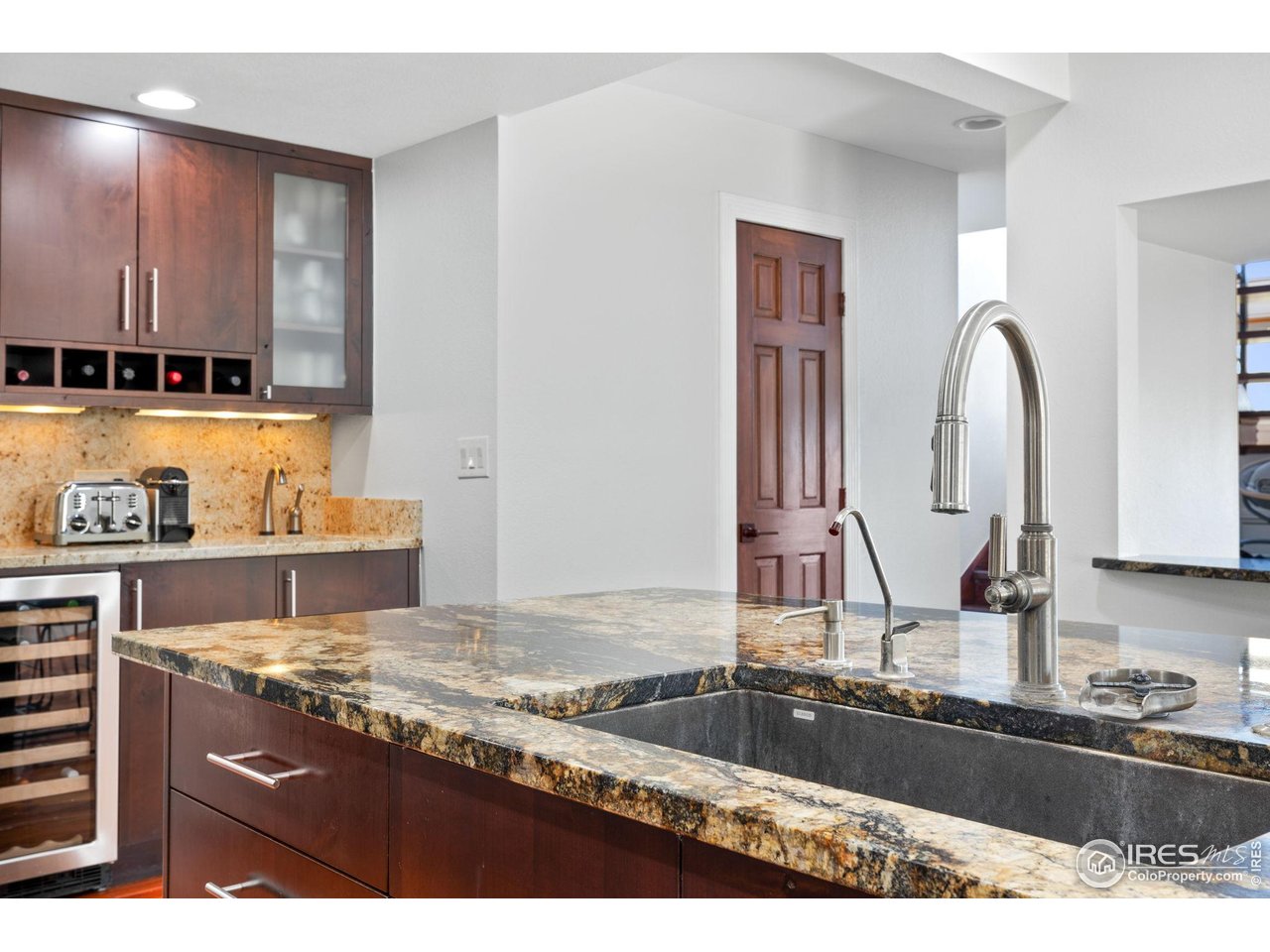 8543 Middle Fork Road Boulder, CO 80302 - Photo 19 of 48 a kitchen with granite countertop a sink and a stove